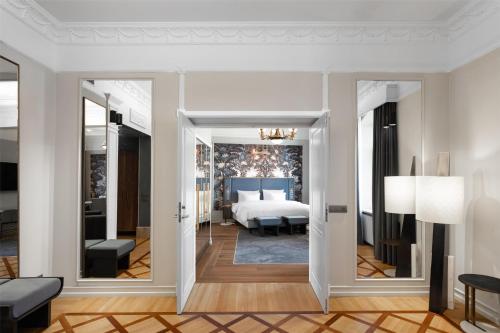 a rendering of a bedroom with a bed at Radisson Collection Astorija Hotel, Vilnius in Vilnius