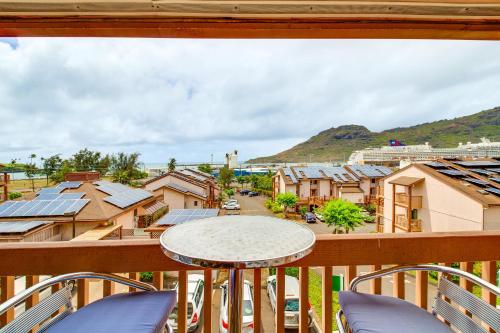 a view from a balcony with a table and chairs at Walk to Nawiliwili Harbor Condo with Saltwater Pool in Lihue