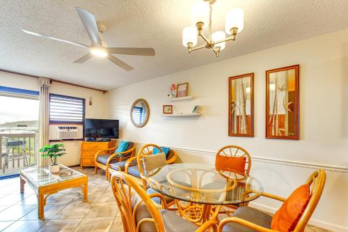 a living room with a glass table and chairs at Walk to Nawiliwili Harbor Condo with Saltwater Pool in Lihue