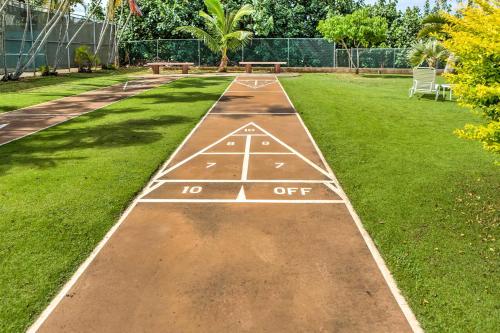 a sidewalk in a park with a hop off sign at Walk to Nawiliwili Harbor Condo with Saltwater Pool in Lihue