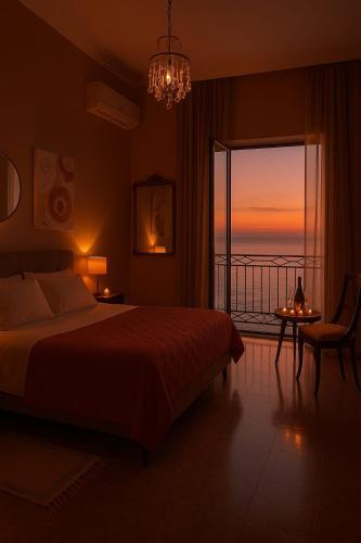 a bedroom with a bed and a view of the ocean at Sagittarius B&B in Cetraro