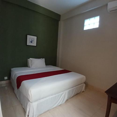 Postel nebo postele na pokoji v ubytování Donata House