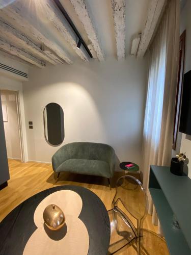 a living room with a couch and a table at Palazzina RIVA in Venice