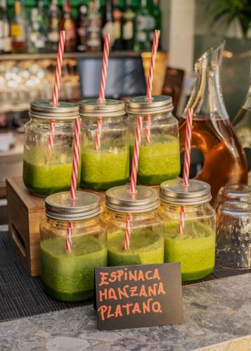 a group of jars of pickles on a table at Vincci Mae in Barcelona