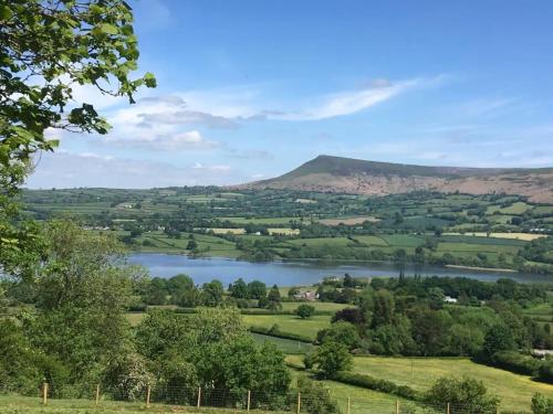 a view of a lake in the countryside at 2 Bed in Crickhowell 90346 in Crickhowell