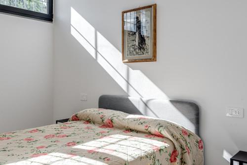 a bedroom with a bed and a stair case at Fossato 35 Flat Pontassieve in Pontassieve