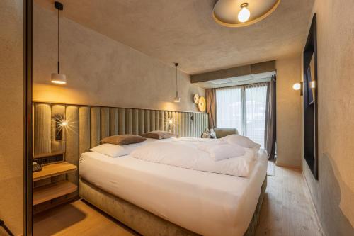 Ein Bett oder Betten in einem Zimmer der Unterkunft Hotel Bäckelar Wirt Superior