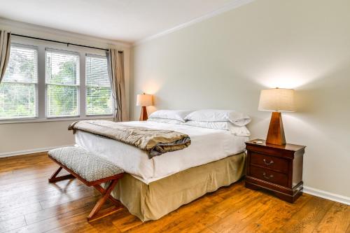 a bedroom with a bed and a lamp on a table at Mtn Cabin with Balcony and View in Burnsville! in Burnsville