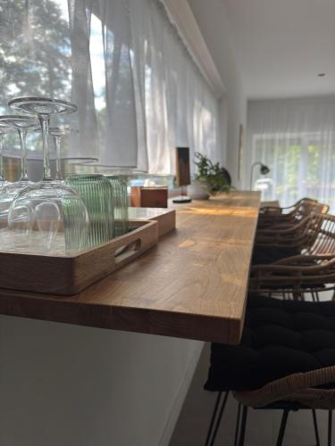 a table with wine glasses on top of it at Two Tangerines in Milicz