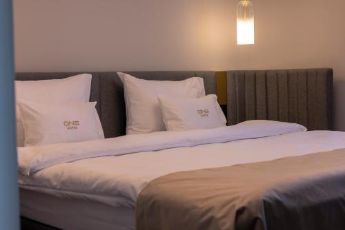 Ένα ή περισσότερα κρεβάτια σε δωμάτιο στο ONE Hotel