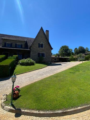 a house with a street light in front of a yard at Quinta do Azibo in Podence