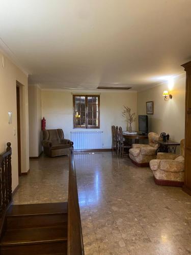 a large living room with couches and a table at Quinta do Azibo in Podence
