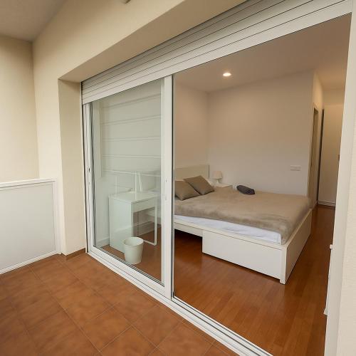 Ένα ή περισσότερα κρεβάτια σε δωμάτιο στο Camp Nou Rooms