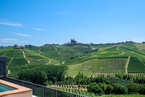 a view of a vineyard from a villa at Foresteria, Winery & Events Destination in Monforte dʼAlba