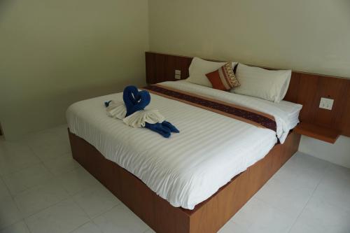 a bedroom with two beds with towels on them at JP Resort Koh Tao in Koh Tao