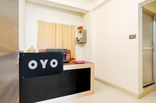 a sign on a tv in a room at Hotel O AAGAMAN HOTEL & RESTAURANT in Begusarai