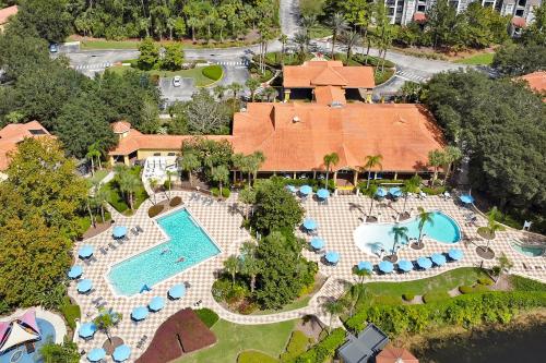 an aerial view of a resort with a swimming pool at Encantada Resort Vacation Townhomes by IDILIQ in Kissimmee