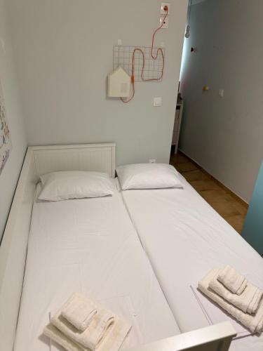 a bed in a room with two towels on it at Koroni Dream House in Koroni