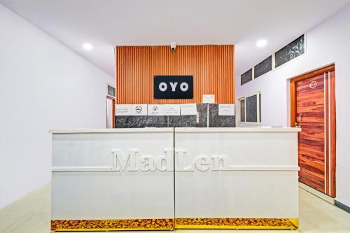 a lobby of a nadaelen store with a sign at Super Hotel O Madlen in Hyderabad