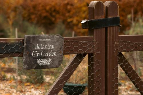 a sign on a fence in a cemetery at Peebles Hydro in Peebles