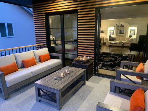a living room with a couch and a table at 33 On Gage Garden Suite in Niagara on the Lake
