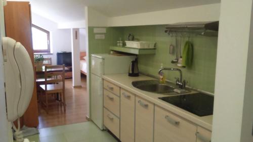Η κουζίνα ή μικρή κουζίνα στο Apartamenty Warka