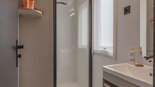 a bathroom with a shower and a sink at Camping Grande Italia in Chioggia