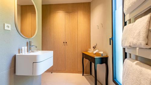a bathroom with a sink and a mirror at Château de Courban and Spa Nuxe in Courban
