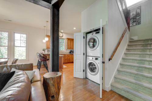 a living room with a washer and dryer at Lake and Pool Access at Bear Lake Reserve Condo! in Tuckasegee
