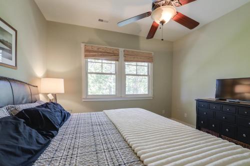 a bedroom with a bed and a ceiling fan at Lake and Pool Access at Bear Lake Reserve Condo! in Tuckasegee