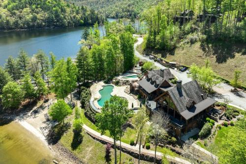 an aerial view of a house with a lake at Lake and Pool Access at Bear Lake Reserve Condo! in Tuckasegee
