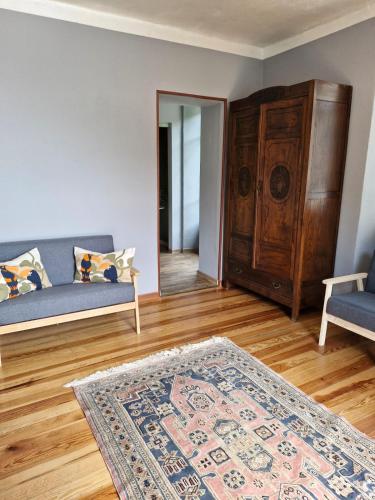 a living room with a couch and a rug at Ponte Fontana in Campiglia Cervo