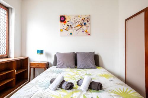 a bedroom with a bed with towels on it at Two room apartment - centre historique in Mulhouse