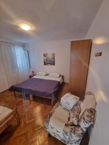 Postel nebo postele na pokoji v ubytování Ivica House