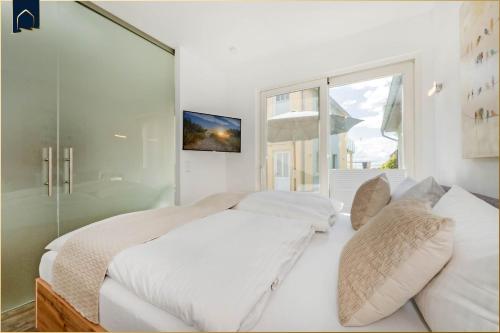 Ένα ή περισσότερα κρεβάτια σε δωμάτιο στο Ferienhaus Kuschelnest