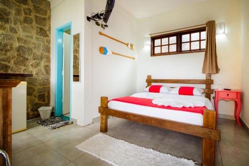 Katil atau katil-katil dalam bilik di VELINN Pousada Guarubela Villa Vittoria
