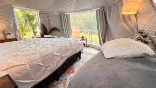 Giường trong phòng chung tại Camp Stella
