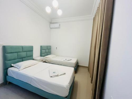 a room with two beds in a room at Dream Garden Djerba in Djerba