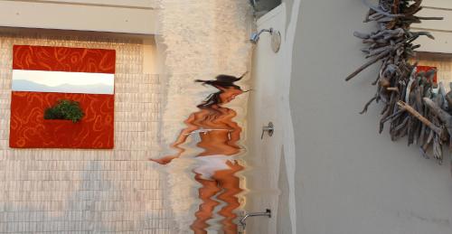 a wall with a painting of a witch on it at Great Lake View Artist's Apartment in Ispra