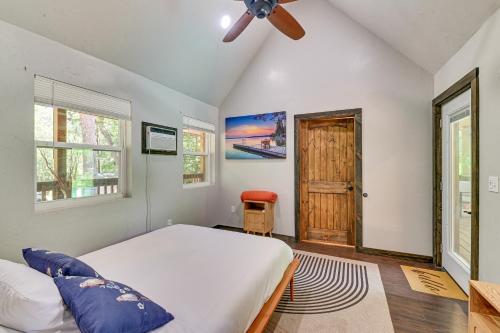 a bedroom with a bed and a ceiling fan at 3 Mi to Lake Texoma Gordonville Getaway! in Shay