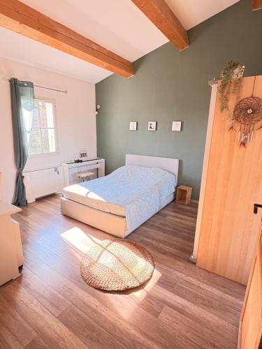 Llit o llits en una habitació de Le bon Vivre