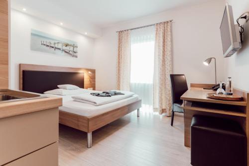 Postel nebo postele na pokoji v ubytování Aparthotel Othello