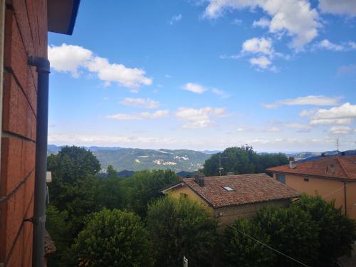 a view of the mountains and trees from a building at Il Rifugio di Mario in Monzuno