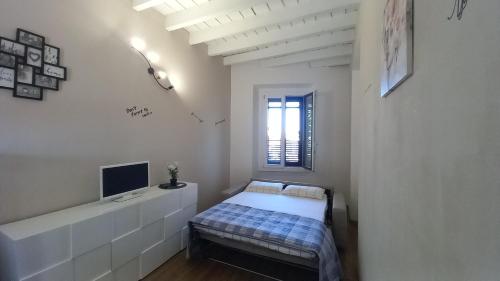 Ένα ή περισσότερα κρεβάτια σε δωμάτιο στο Cavour 35