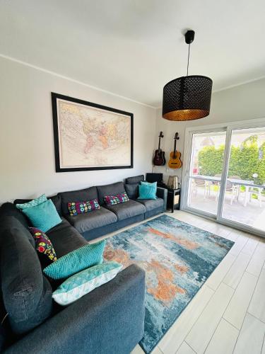 a living room with a couch and a rug at Casa Tramonto in Palmi