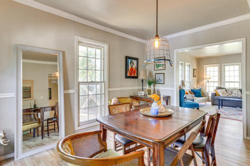 a dining room and living room with a table and chairs at 3 Mi to Dtwn OKC Pet-Friendly Paseo Gem! in Oklahoma City