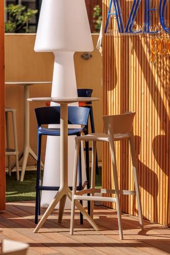 a table and two chairs sitting next to a lamp at ibis Nice Centre Gare in Nice