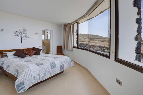 En eller flere senge i et værelse på Casa Bea Villaverde