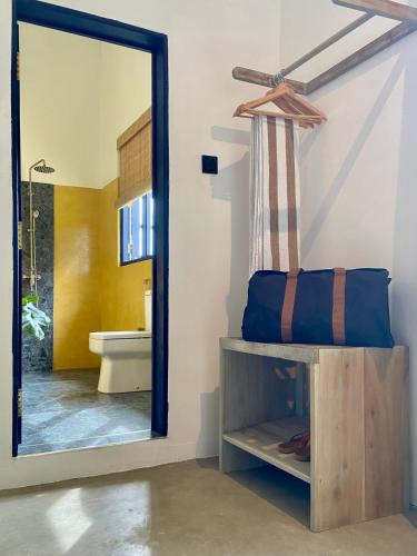 a bathroom with a mirror and a sink at Beachside Stay Steps From Mawella Bay, Tangalle #thisisnotahotel in Mawella