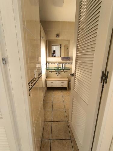 a bathroom with a sink and a mirror at Benyamina House in Torremolinos